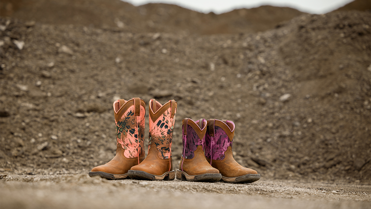 Both women's Rush boots in Russet Brown (SE4356) and Harvest Brown (SE4358) standing on dirt.